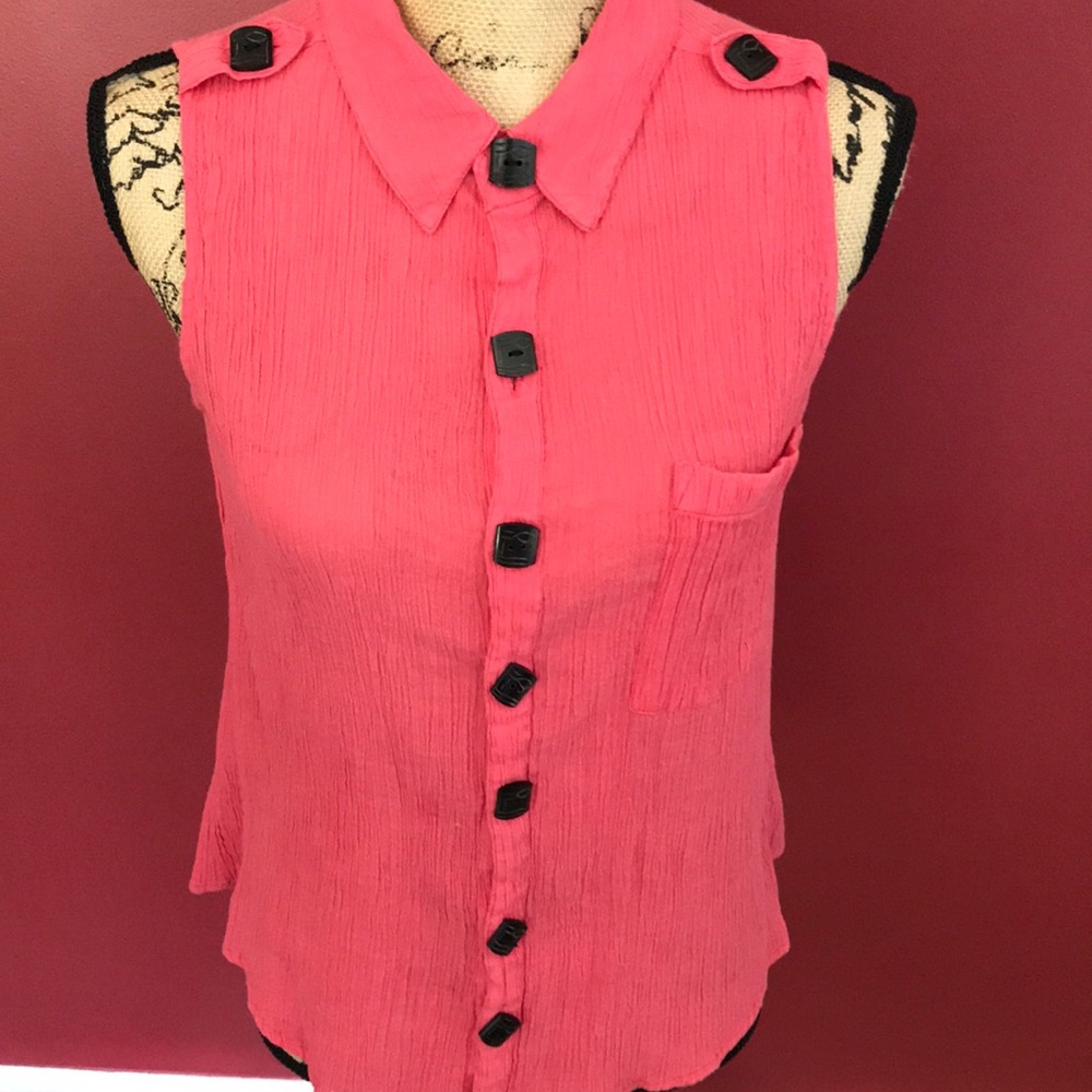Ladies crepe feeling short sleeve button down blouse in a soft raspberry color.